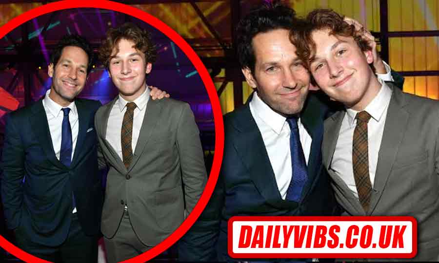 Jack Sullivan Rudd standing with his father Paul Rudd at a public sports event